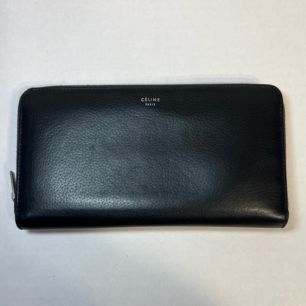 Celine Black Leather Zip Around wallet with a bright yellow leather interior‎